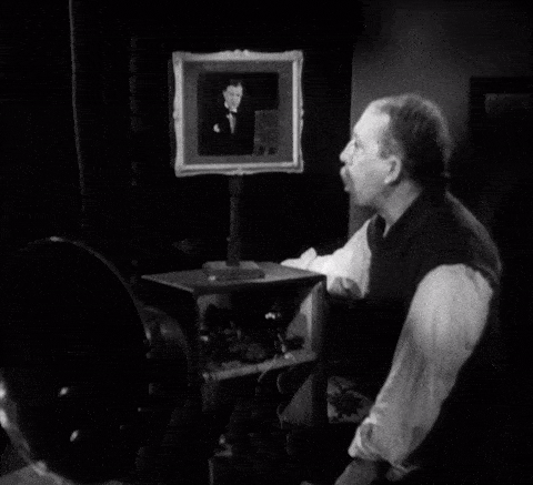 Elstree Calling. Gordon Harker tunes in Tommy Handley on TV.