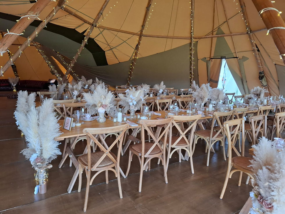trestle tables set up inside the tipi