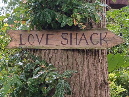 Wooden arrow with Love Shack on it