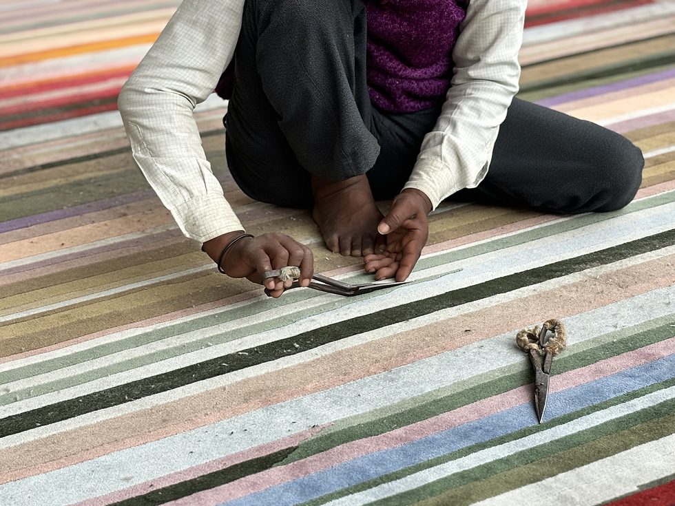 Eye-level view of a hand-knotted rug with geometric patterns