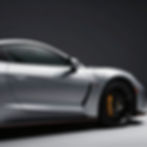 Professional auto detailing on a silver sports car.
