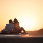 Couple watching a sunset enjoying a romantic stay in Healdsburg wine country.