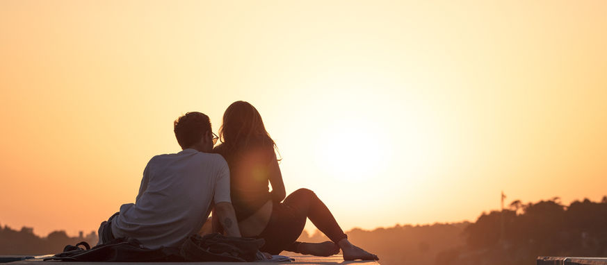 Couple watching a sunset enjoying a romantic stay in Healdsburg wine country.