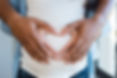 Black man holding belly of his pregnant 