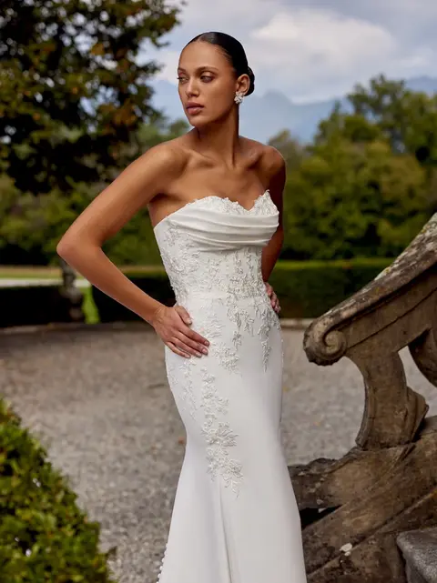 Strapless fit-and-flare wedding dress by Justin Alexander with minimalist silhouette and clean modern bridal style at Rebecca’s Wedding Boutique Louisville KY.