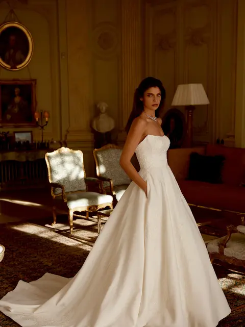 Strapless Mikado A-line wedding dress by Justin Alexander with clean modern skirt, photographed for bridal shopping at Rebecca’s Wedding Boutique in Louisville KY.