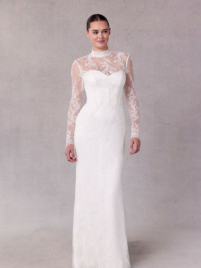 Two Piece wedding dress has soft satin inner dress with corset boning and a Chantilly lace outer dress with a high neckline and long sleeves.