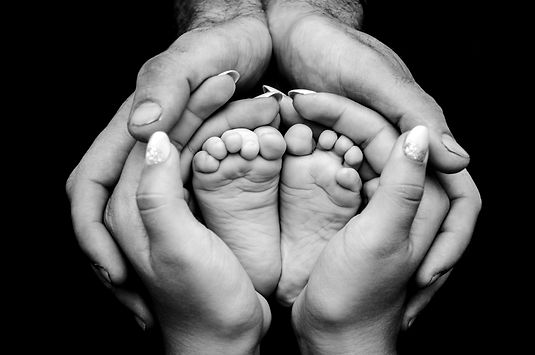 greyscale photography of human feet and hand_edited.jpg