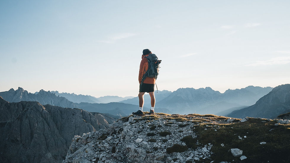 Man on the peak of a mountain
