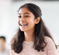 Girl speaking up confidently in her Primary School English Tuition Class.