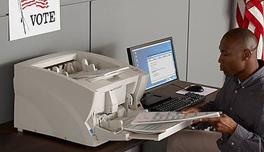 OpenElect OVCS page - man operating the machine.jpg