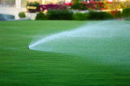 bigstock-Automatic-sprinklers-watering-69109339.jpg
