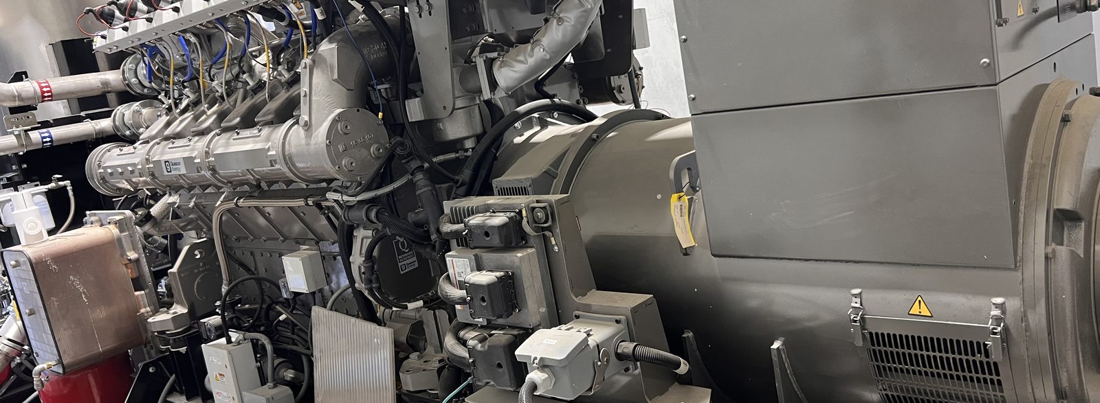 Large engine-driven generator set inside a building