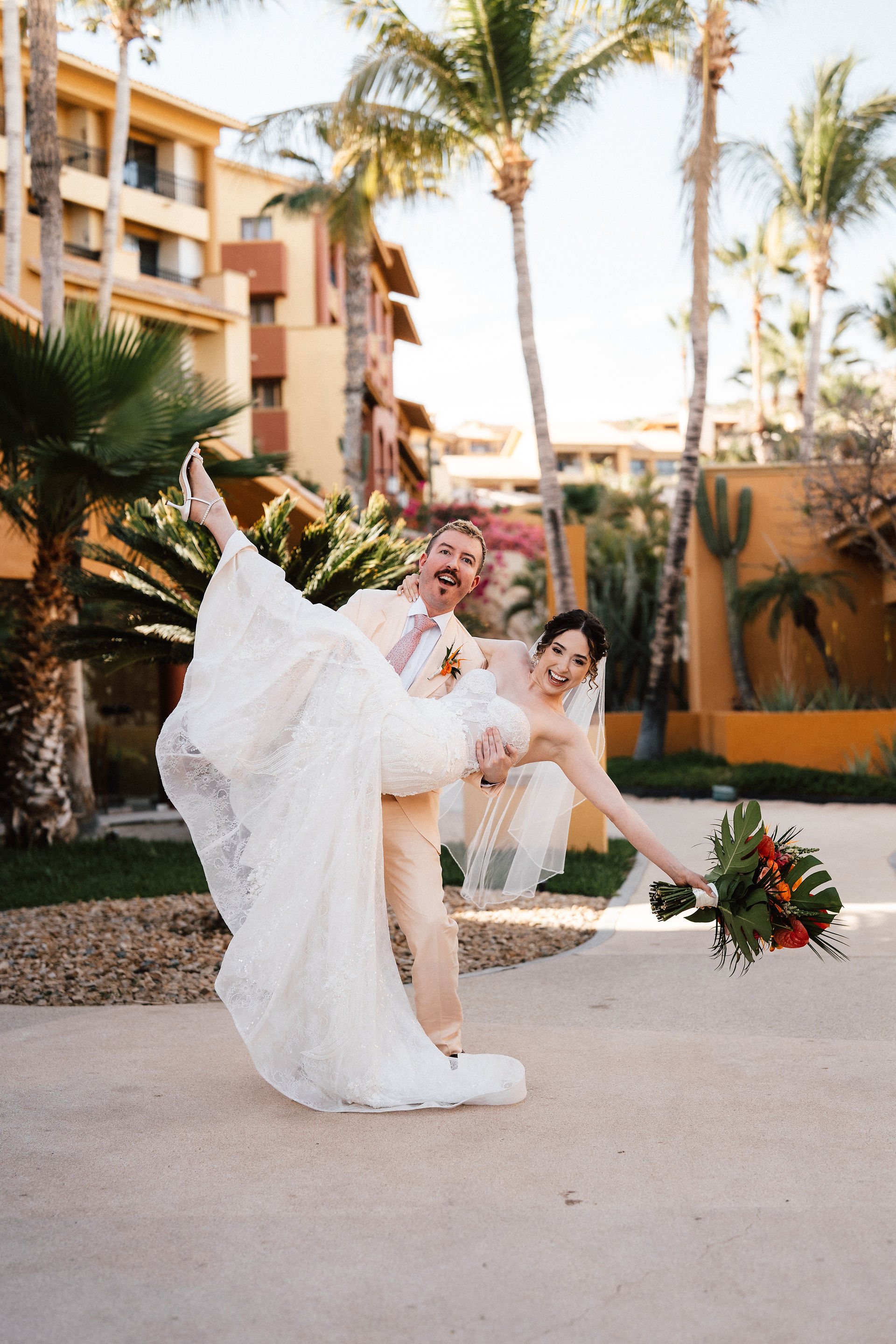 The groom is holding the bride