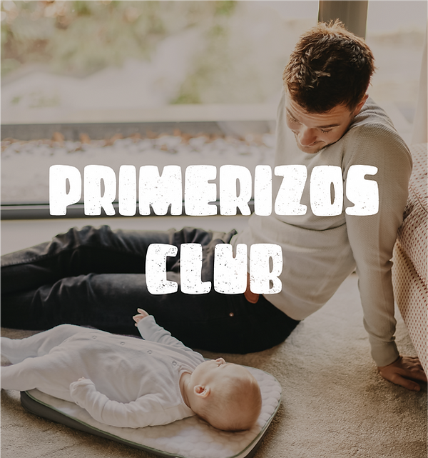Father and baby son on the floor with Primerizos Club logo watermark