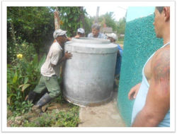 Many hands guide the tank around the church of Cristo Rey