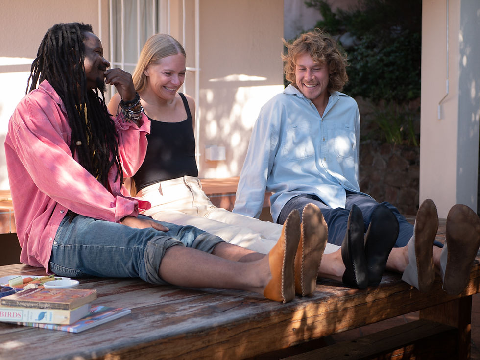 Group of friends hanging out while matching in their recycled leather barefoot shoes made for comfort and sustainable living