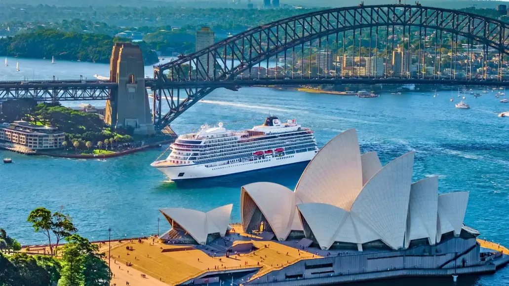 Viking ocean ship in Sydney Harbour beside the Sydney Opera House and Harbour Bridge