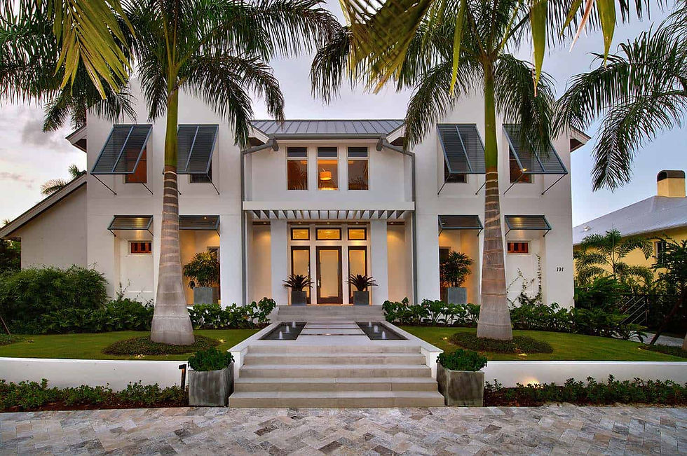 Modern coastal luxury home in Naples Florida with tropical landscaping and contemporary architectural design