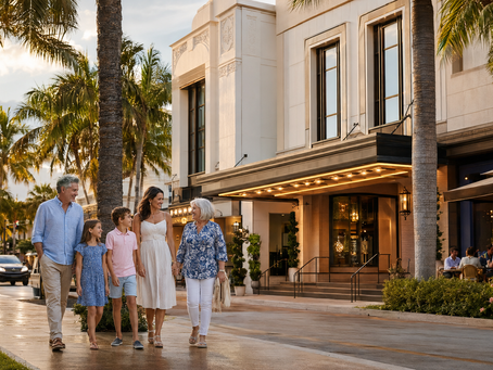 A multigenerational family walks toward an elegant downtown Naples theater after a summer rain, surrounded by palm trees and outdoor cafés.