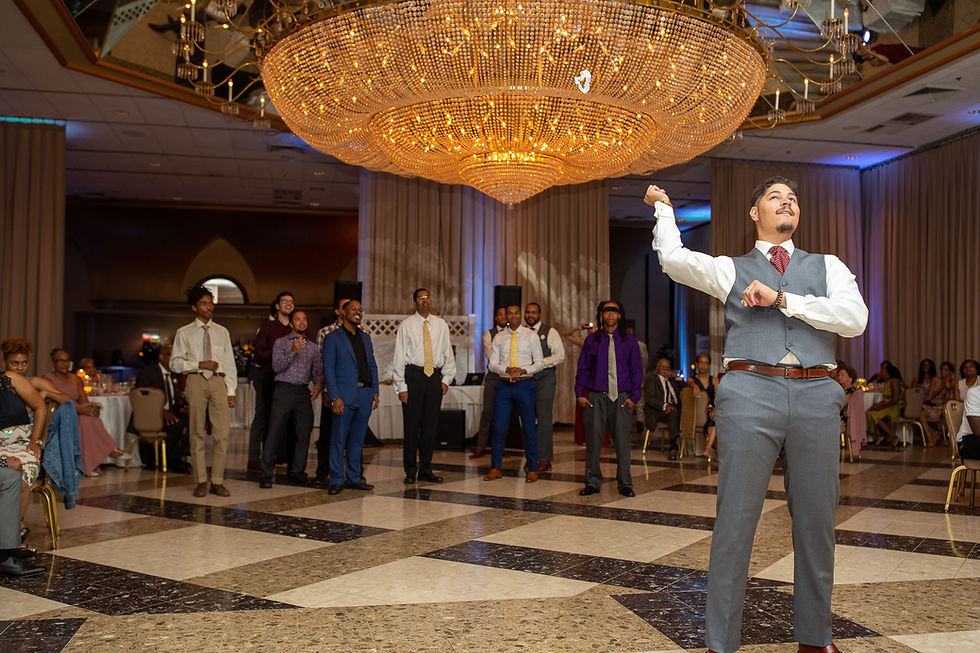 Groom tossing the bridal garter during the wedding reception at Martin's Crosswinds in Greenbelt, Maryland.