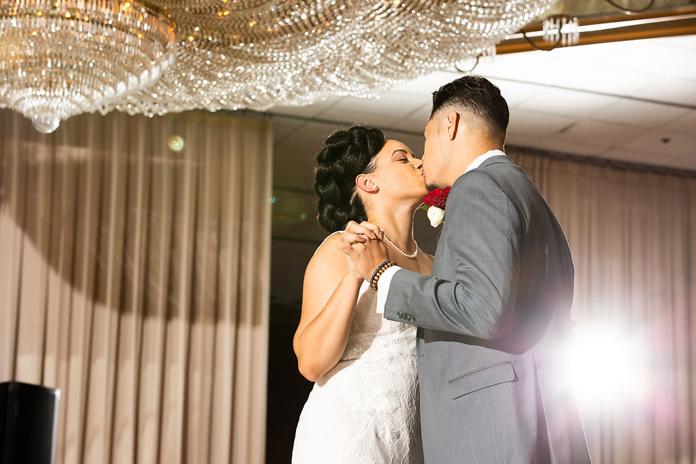 Bride and groom finish their first dance off with a kiss during the wedding reception at Martin's Crosswinds in Greenbelt, Maryland.