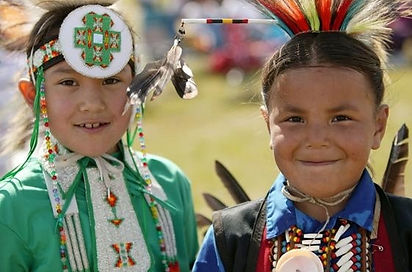 Saskatchewan_First_Nations_Children_at_Wanuskewin_Heritage_Park_staring_into_camera.jpg