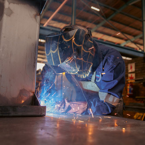 BMG Engineer welding in an engineering workshop