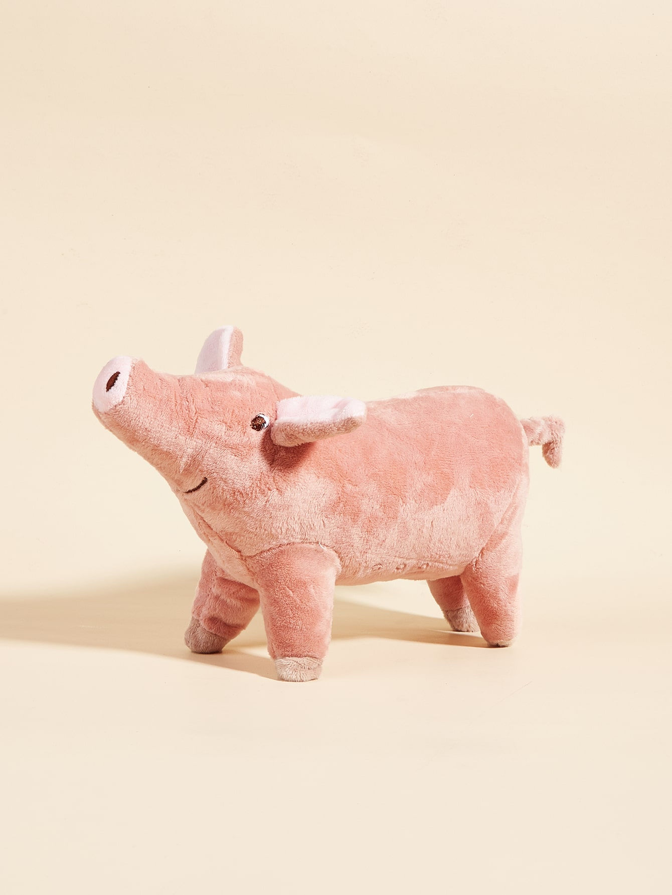 Um brinquedo de pelúcia de moagem de dentes de animal de estimação com design
