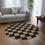 Thumbnail: Vintage-Inspired Round Rug with Checkerboard Design | Cozy Home Decor