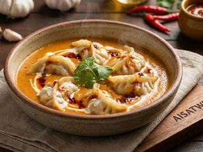       Chili-Garlic Momos in Makhani 