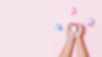 Child's hands holding big tooth and toothbrush on pink backgroubd. Healty care teeth conce