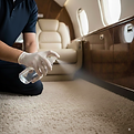 Miami Prestige Detailing spraying refresher product on private jet carpet
