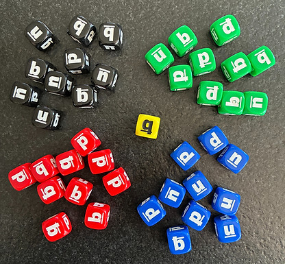 black, green, red and blue dice with letters on them