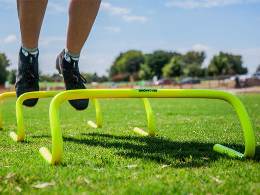 youth athlete doing an agility exercises over the summer