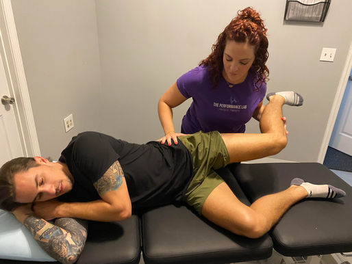 Physical therapist mobilizing a hip
