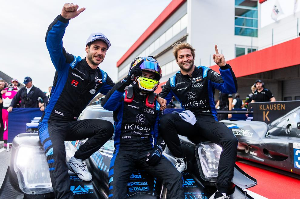 Credit: Marcel Wulf | Giorgio Roda (right) celebrating with teammates Bent Viscaal (middle) and René Binder (left) after their win in the 4 Hours of Portimão