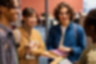 university-colleagues-talking-library.jpg