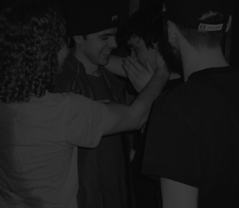 A picture of The Night Cafe in a group hug.