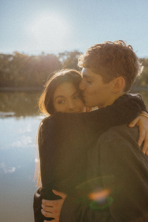 Couples session at a park hugging