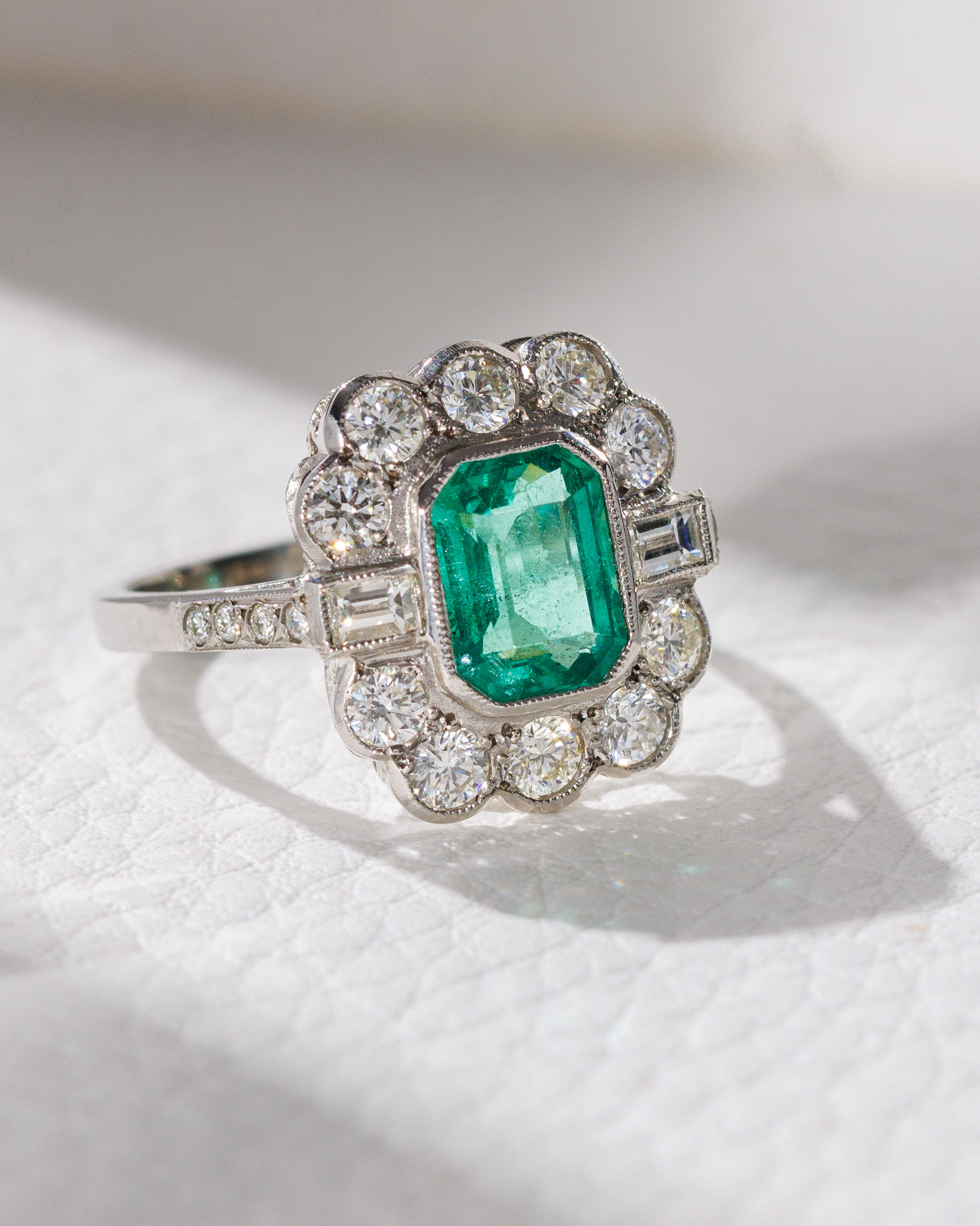 Emerald and vari cut diamond ring
