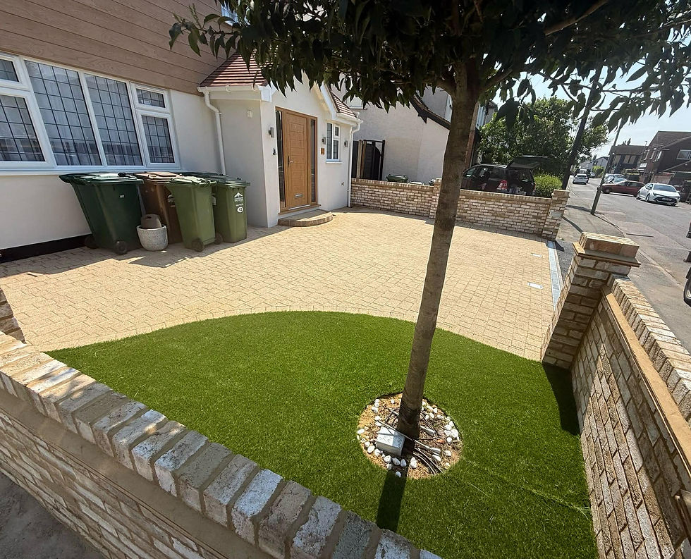 Paved front yard with artificial grass and a central tree