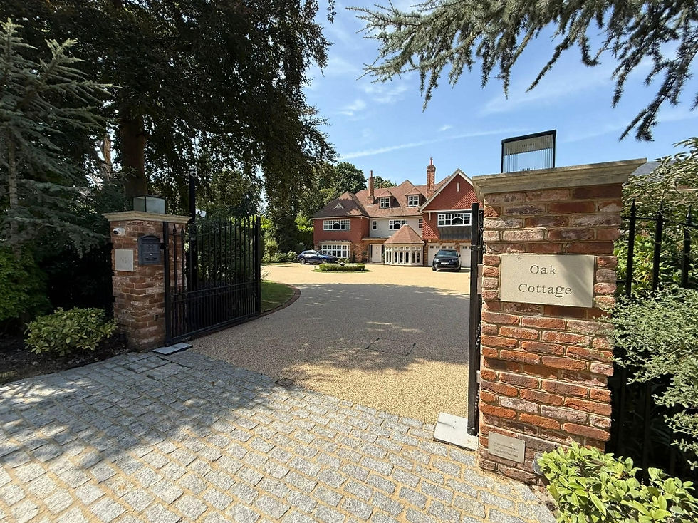 Oak Cottage house behind open brick gate