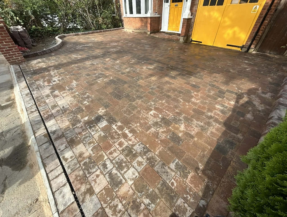 Newly paved brick driveway in front of a house