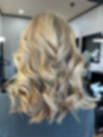 Bright blonde hair with customized highlights by an AVEDA stylist at Bella Dolche Salon and Spa in Everett, WA