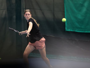 Female player lining up a forehand