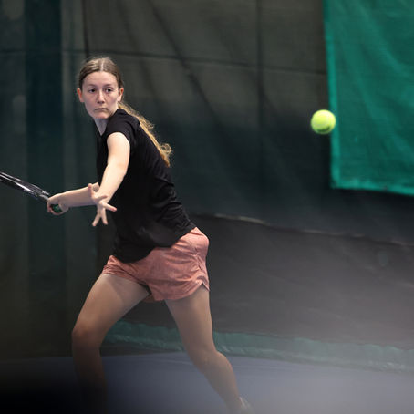 Female player lining up a forehand