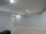 white drop ceiling in a finished basement