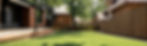 cozy-house-with-patio-green-lawn-wooden-fence