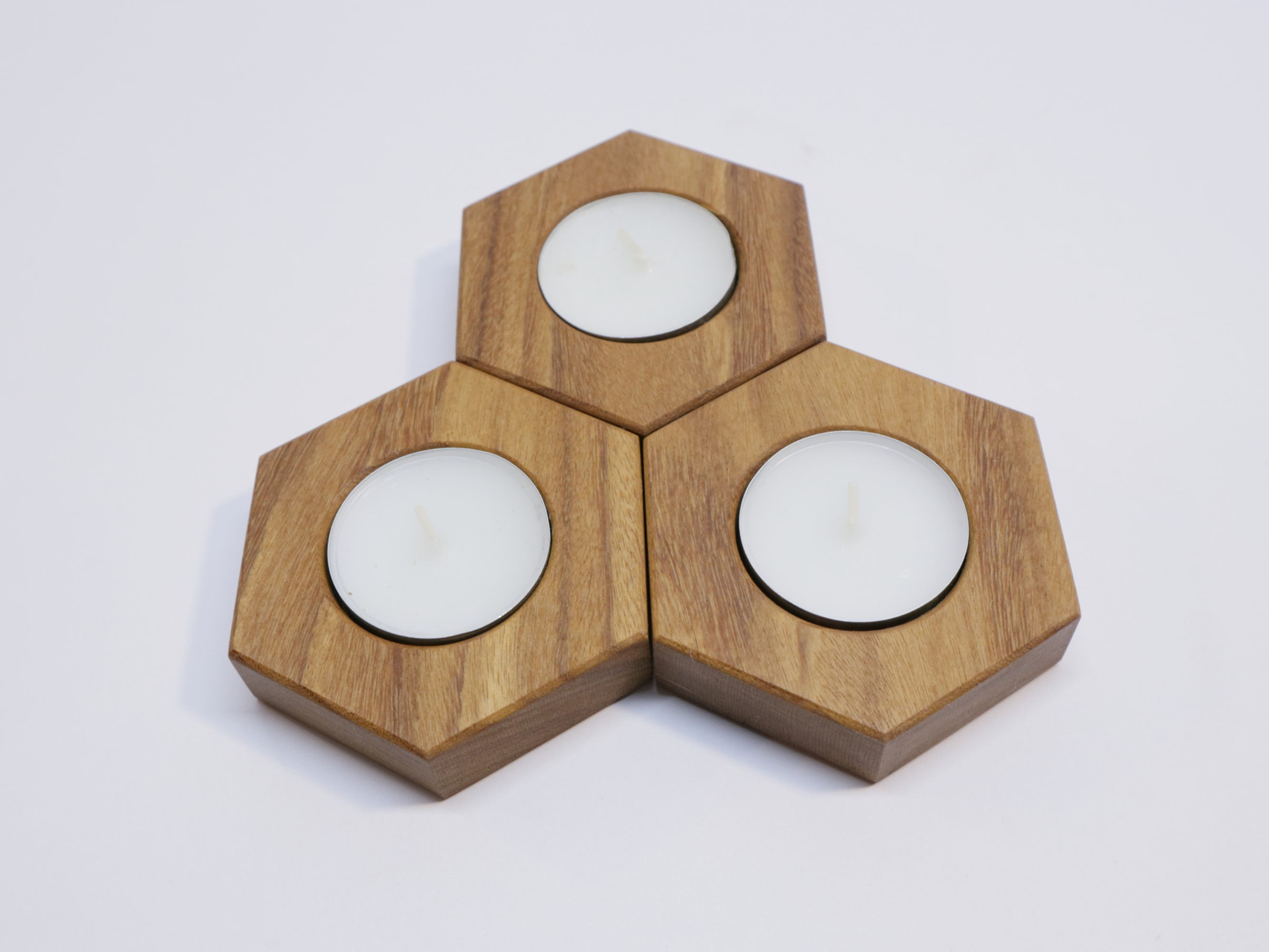 Afrormosia Hexagon Tea Light Candle Holder 3pcs set – Measures 2 3/4” wide by 3/4” tall , on white background. (view 1)